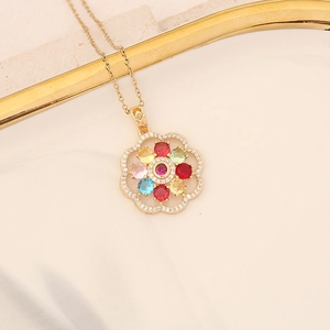 Golden necklace with a multi-colored floral gemstone pendant on a refined gold chain