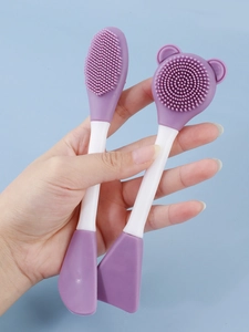 Close-up of double-headed silicone facial brush for deep cleansing and mask application
