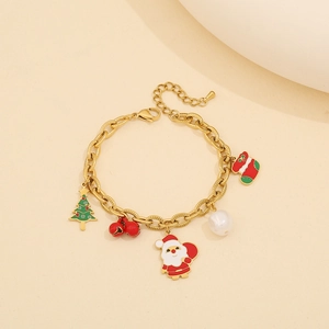 Bracelet à charms de Noël en acier inoxydable doré avec des pendentifs de père Noël.