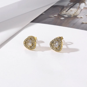 Macro shot of 18k gold plated heart earrings with sparkling cubic zirconia detailing