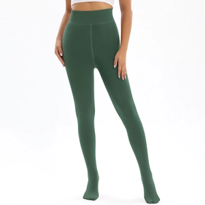 Detail of high waist ribbed waistband on dark green winter fleece-lined leggings