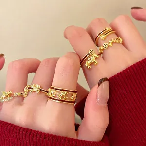 Gold-plated carousel horse open ring set with red enamel and vintage coin charms