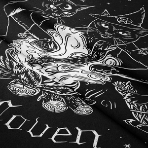 Macro detail of gothic cat tapestry showing high-quality twill texture and Coven print