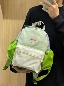 Lightweight avocado green and ivory school backpack with WanWanda embroidery patch