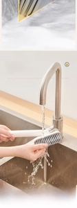 Detail of V-shaped rotating crevice brush with PET bristles and hanging hole for bathroom