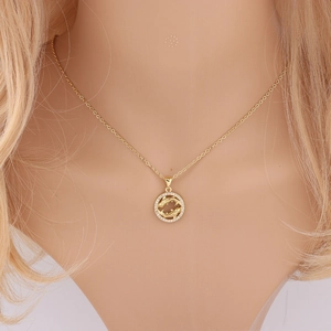 Detail of gold Pisces zodiac necklace with rhinestone circle and delicate O-chain