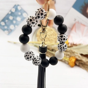 Leopard print silicone bead wristlet keychain with black tassel and gold hardware