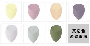 Detailed macro view of multi-colored teardrop makeup sponges with slanted edges