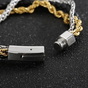 Three-layer braided leather and steel chain bracelet with a gold and silver magnetic clasp
