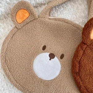 Detailed close-up of khaki plush bear tote bag with soft lamb wool texture and zipper