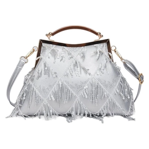 Silver sequin evening bag with tassels, gold metal handle, and detachable chain strap