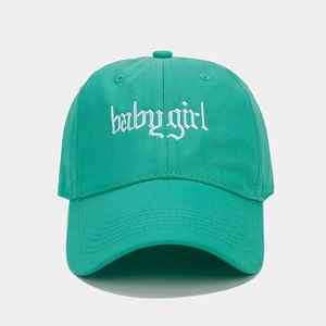 Close-up of baby girl gothic embroidery on a green cotton twill baseball cap