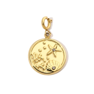 Detailed close-up of golden round pendant featuring starfish shell and coral relief with crystals