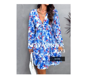 Detail of elegant V-neck floral print maxi dress featuring layered tiered skirt design