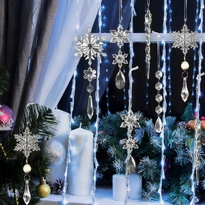 Close-up of clear acrylic Christmas icicles and snowflake pendants with festive LED lighting