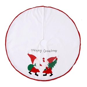 White Christmas tree skirt with festive gnomes and Merry Christmas embroidery