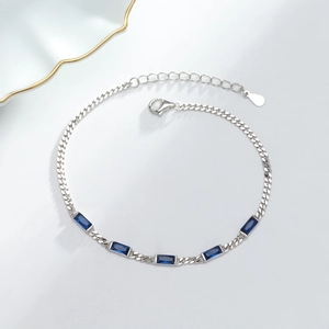 Detailed close-up of S925 silver chain featuring five claw-set deep blue rectangle crystals
