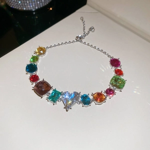 Macro view of multi-color gemstone bracelet with adjustable silver sliding closure