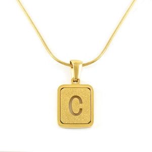 Detail of 18K gold plated rectangular pendant with matte finish and hollow letter C