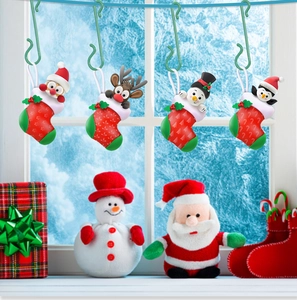 Detail of colorful Christmas stocking hooks with Santa, reindeer, and snowman figurines