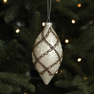 White diamond-studded Christmas ball ornament hanging on a festive tree branch