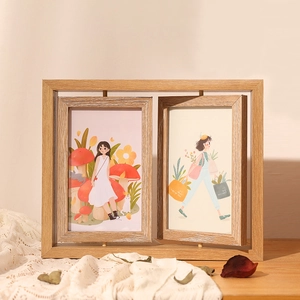 Creative 360-degree rotating double-sided wooden photo frame on a lace tablecloth