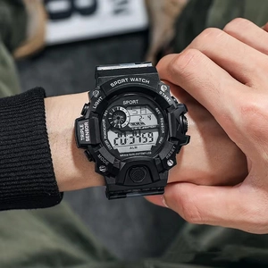 Close-up of black tactical sport watch featuring digital display and WR30M water resistance