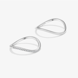 Minimalist S925 sterling silver wave ring set with small zircon stones on white background