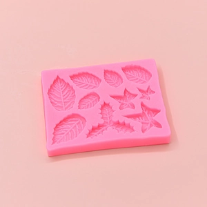 Pink silicone mold featuring detailed leaf patterns for fondant cake and chocolate DIY
