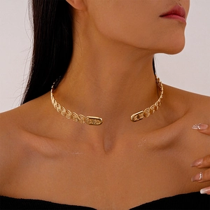 Detailed view of golden twisted braided metal choker with high-gloss mirror finish for women