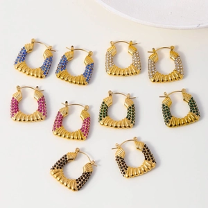 C-shaped gold hoop earrings with baroque texture and colorful pavé crystals in five colors