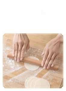 Macro detail of a smooth solid wood rolling pin on a flour-dusted surface for baking