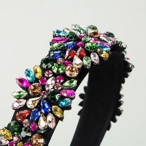 Vintage floral headband featuring colorful crystals and rhinestones on black fabric base