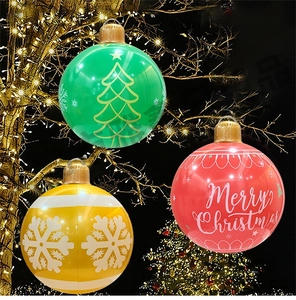 Macro detail of three inflatable Christmas PVC ball ornaments with hanging rings for garden