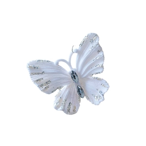 White flocked butterfly ornament with silver glitter edges and sparkling grey rhinestones