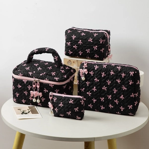 Black and pink bow quilted makeup bag set with four travel organizers and pearl zippers