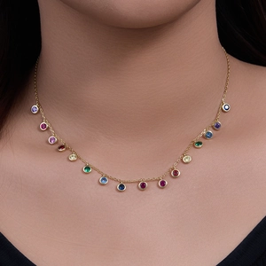 Bohemian style s925 silver necklace with rainbow colored round gemstones on a gold chain