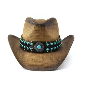 Detail view of woven straw cowboy hat featuring vintage turquoise beadwork and silver metal emblem