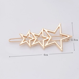 Detail showing dimensions of a gold alloy star-shaped hair clip with three hollow stars