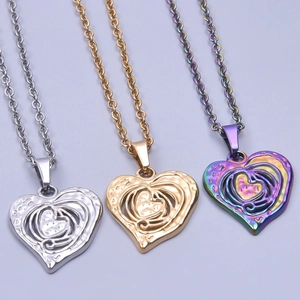 Three-color heart-shaped hollow pendants in silver, gold, and rainbow stainless steel