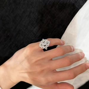 Macro shot of a luxury cluster zircon oval open ring in a vintage silver finish