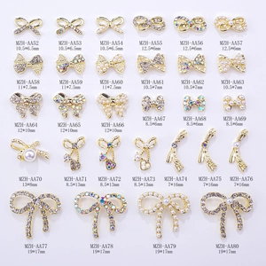Macro display of bowknot nail charms set with pearls and rhinestones in various sizes