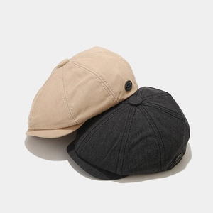 Classic khaki and dark grey newsboy caps with vintage 8-panel structure and metal side logo