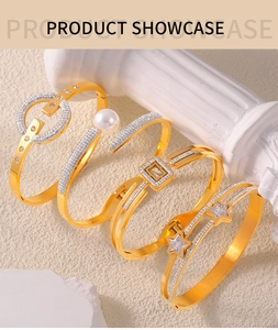 Detail shot of gold-plated layered bracelet set with pearls, zircon stones, and star motifs