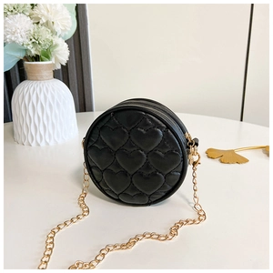 Detail of black quilted heart round crossbody bag with golden chain and zipper