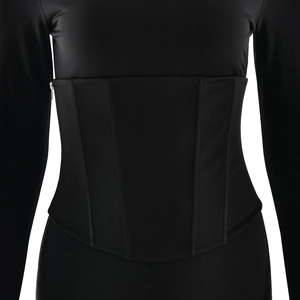 Detailed view of structured black waist cincher with corset bone design over dress