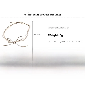 Detailed view of bow necklace dimensions with pearl chain and leather strap