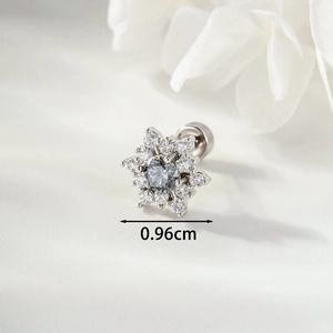 Silver snowflake stud earring with grey crystal center and tiny diamonds on white petals