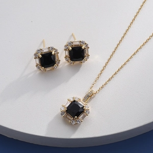 Detailed set of golden necklace and stud earrings with black square zircon stones