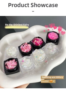 Detailed view of 8 jars containing colorful star and heart shaped glitter for nail art decoration